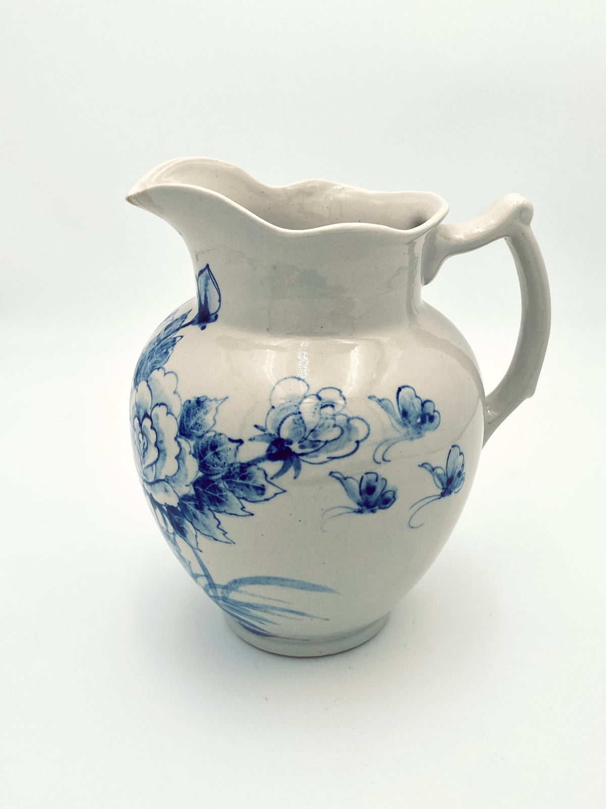 La très grande cruche de fleurs