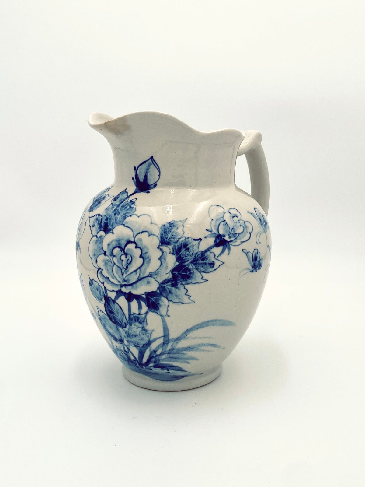 La très grande cruche de fleurs