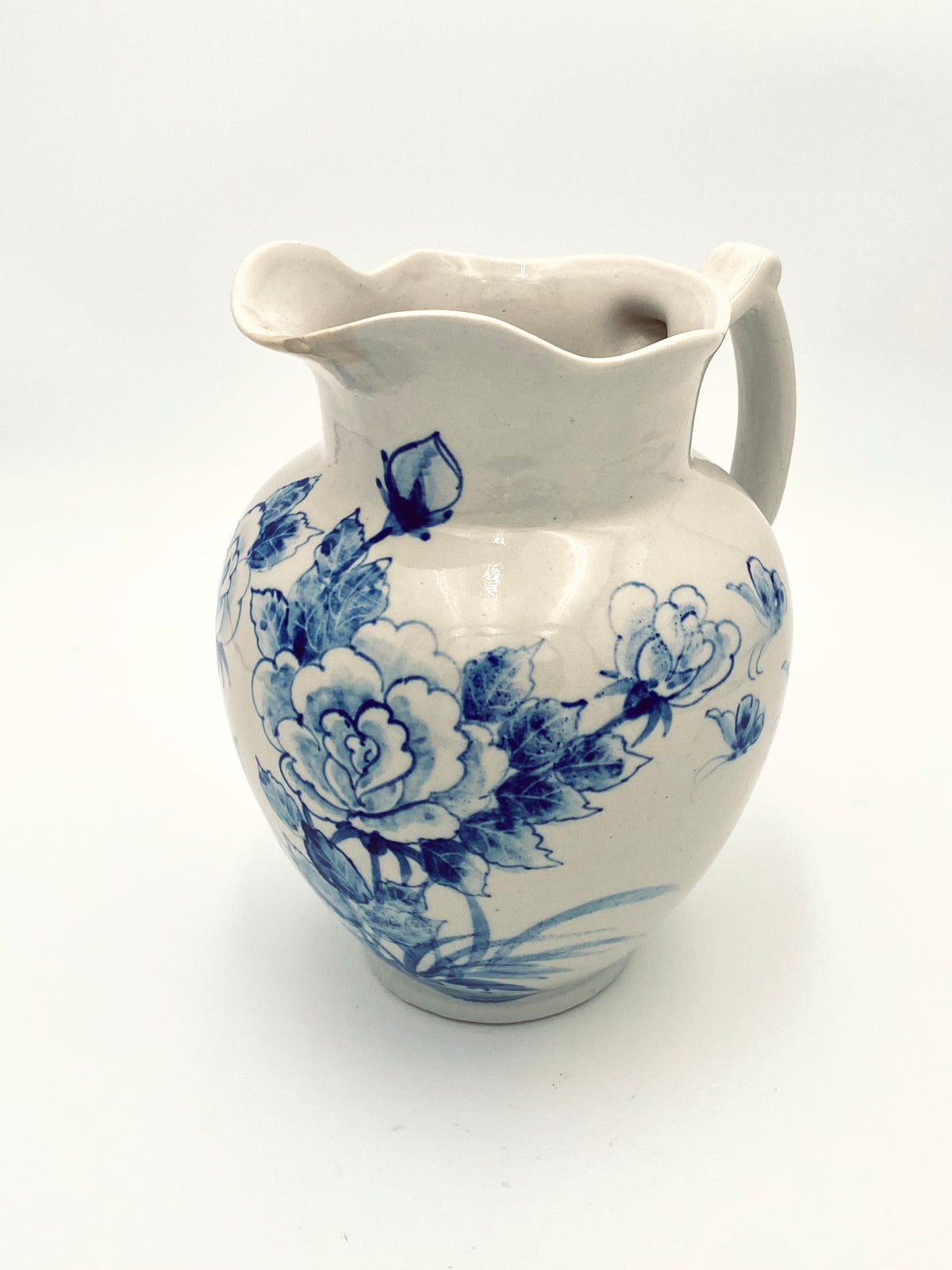 La très grande cruche de fleurs