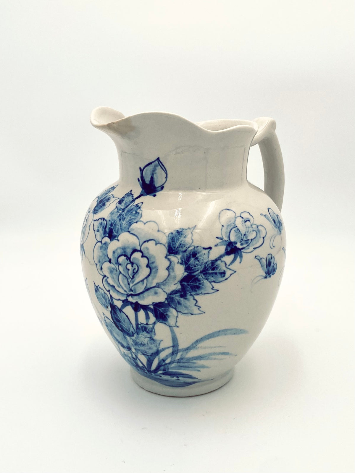 La très grande cruche de fleurs