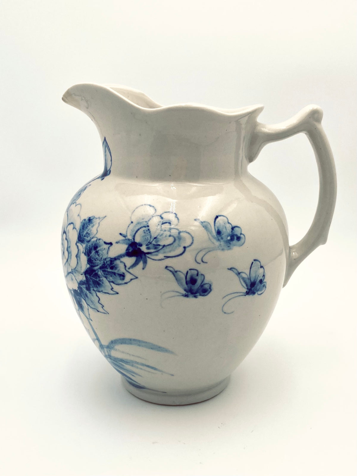 La très grande cruche de fleurs