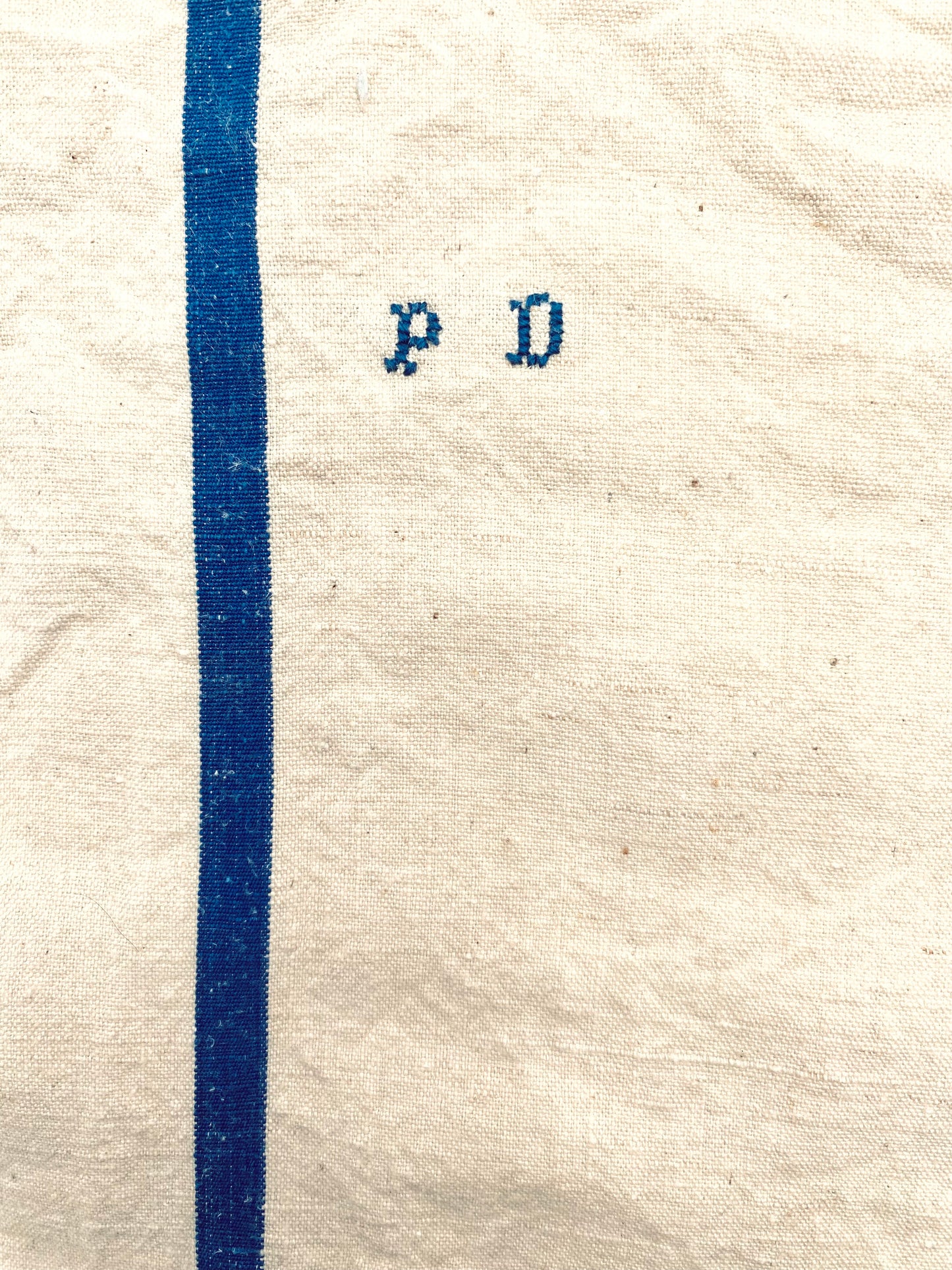 Le torchon en lin à rayures bleues