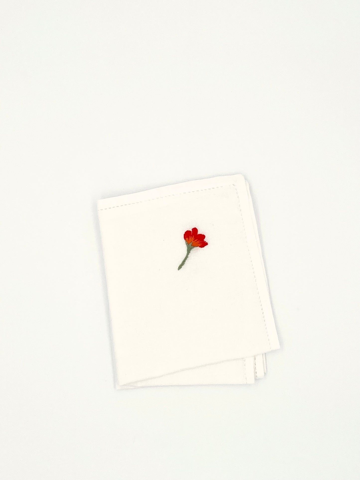 Les serviettes avec un coquelicot