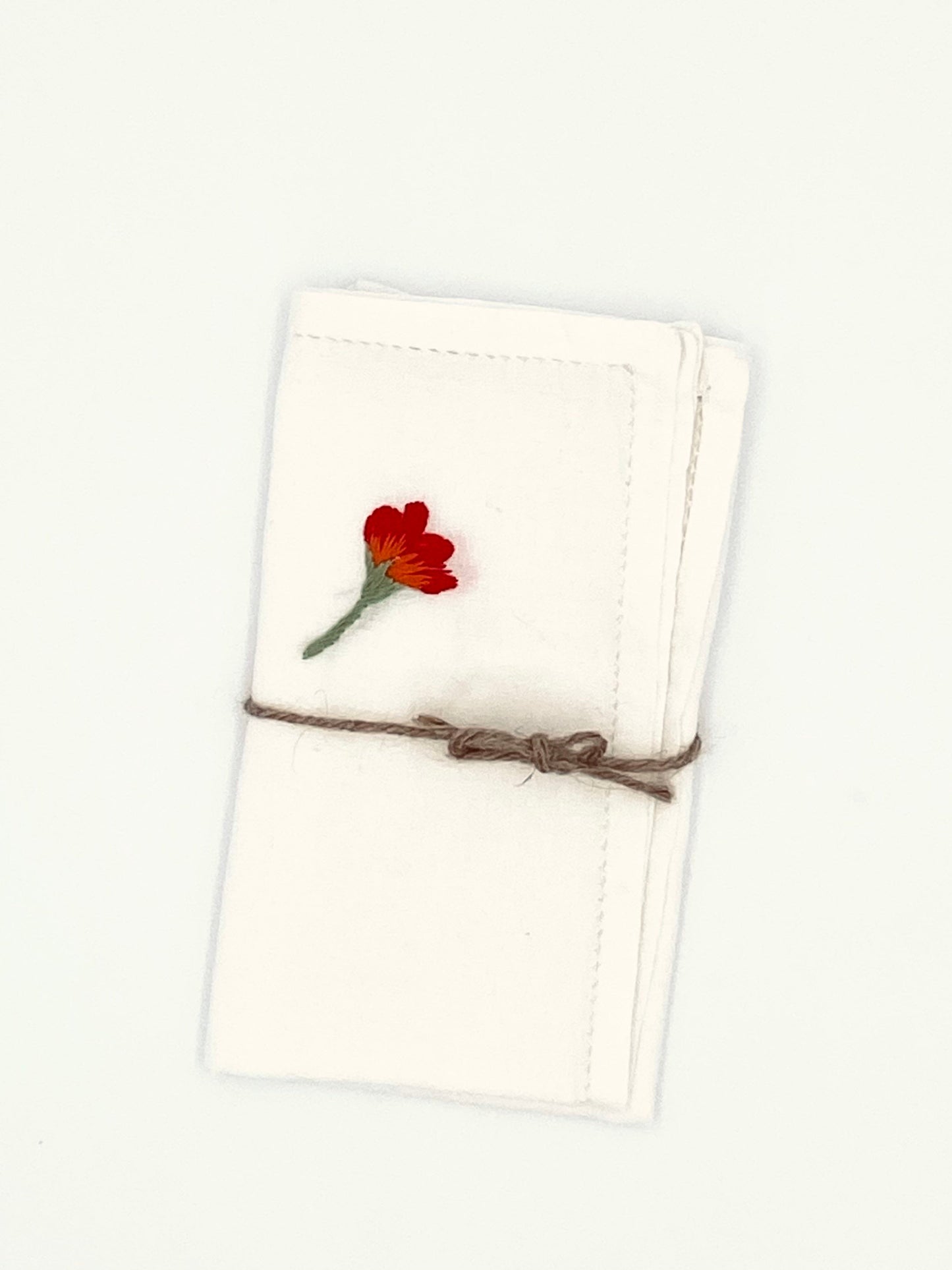 Les serviettes avec un coquelicot